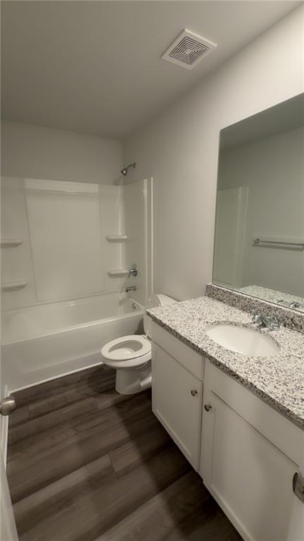 122 Brexley Drive Calhoun, GA 30701 - Photo 22 of 28 a bathroom with a granite countertop sink a toilet and bathtub