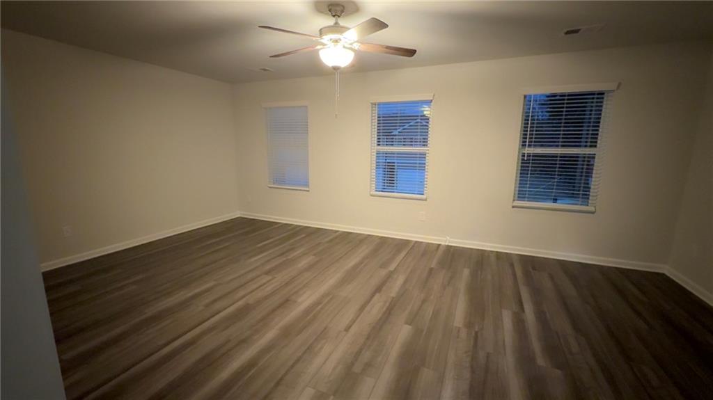 122 Brexley Drive Calhoun, GA 30701 - Photo 24 of 28 a view of an empty room with wooden floor and a window