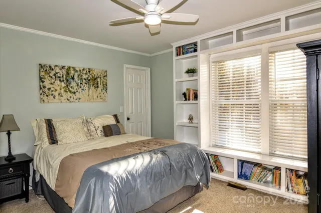 a bedroom with a large bed and a window