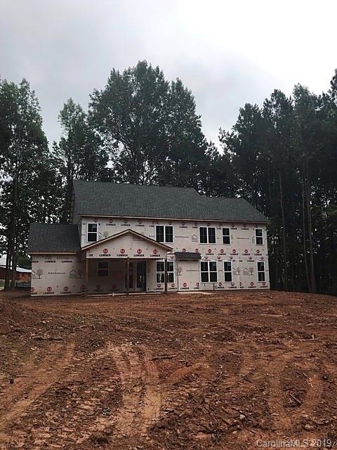 5359 Fewell Road Clover, SC 29710 - Photo 8 of 13 a front view of a house with large garden