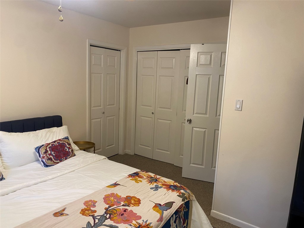 2414 South 5th Street, Unit A Austin, TX 78704 - Photo 11 of 18 a bedroom with a bed and a table