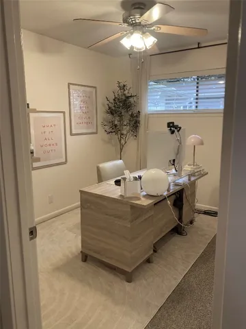 a living room with a bed furniture and a chandelier