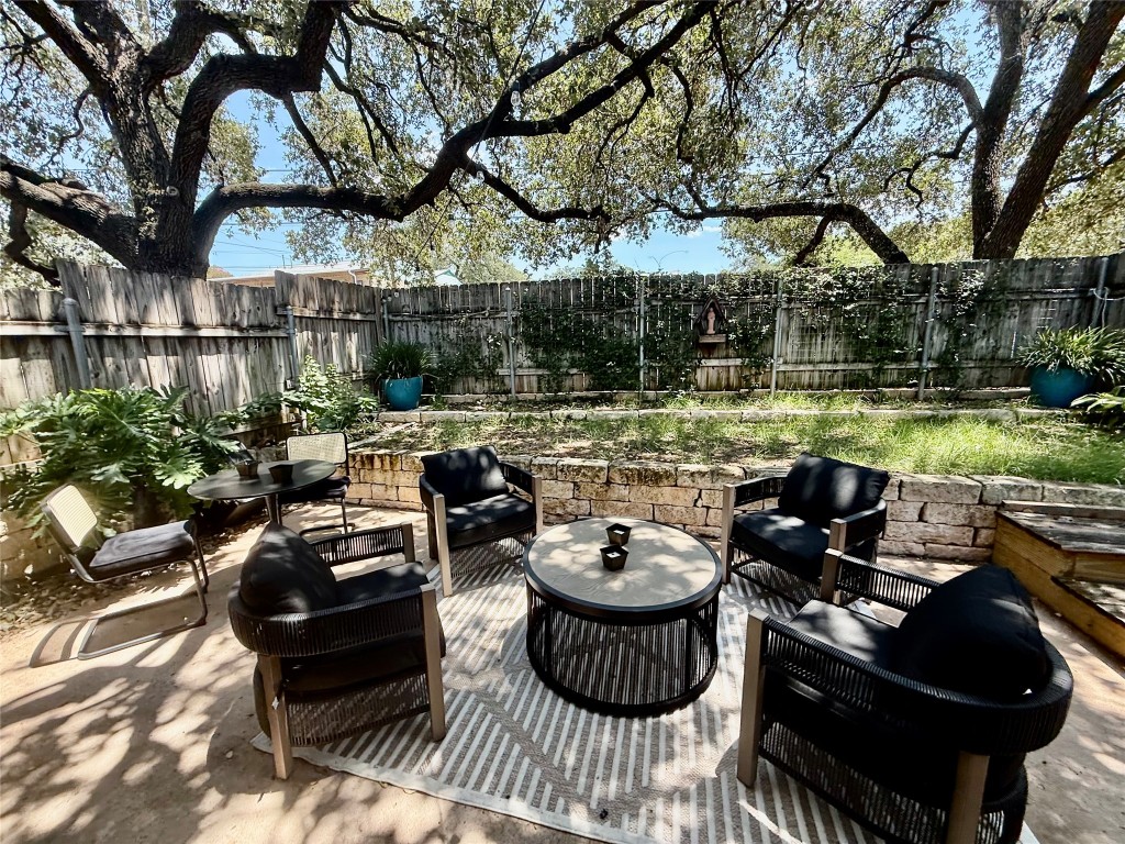 2414 South 5th Street, Unit A Austin, TX 78704 - Photo 7 of 18 a view of a patio with couches table and chairs and potted plants