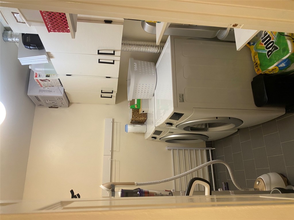 2414 South 5th Street, Unit A Austin, TX 78704 - Photo 9 of 18 a utility room with dryer and washer