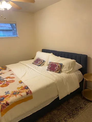 a bedroom with a bed and closet