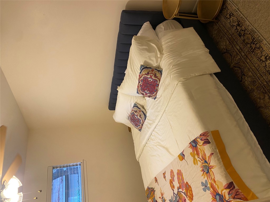 2414 South 5th Street, Unit A Austin, TX 78704 - Photo 10 of 18 a bedroom with a bed and closet