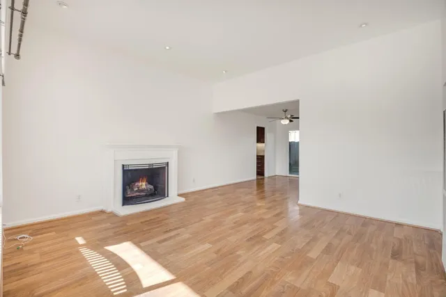 a view of empty room with a fireplace