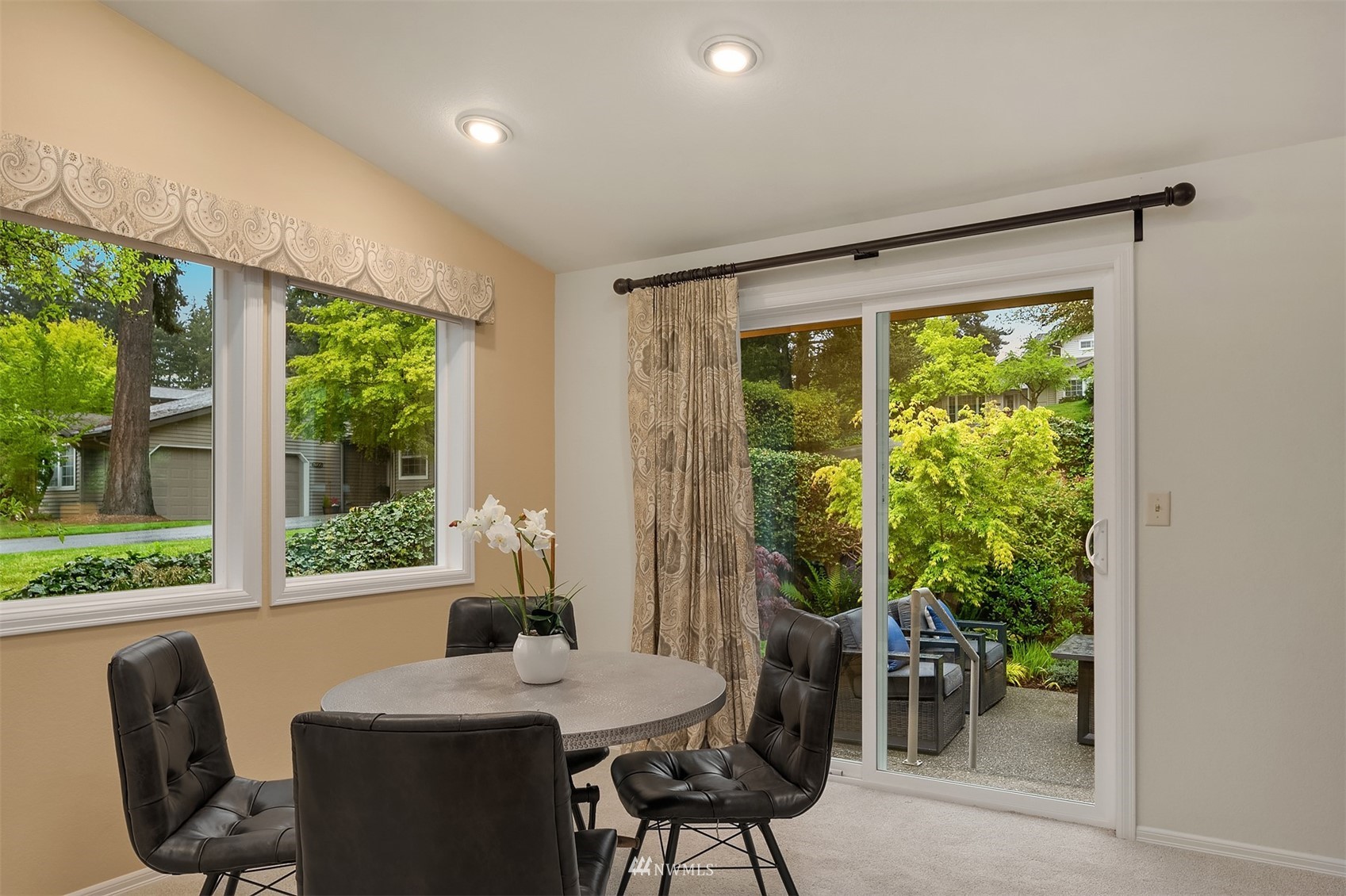 6730 114th Avenue Southeast Bellevue, WA 98006 - Photo 11 of 32 a view of a dining room with furniture window and outside view