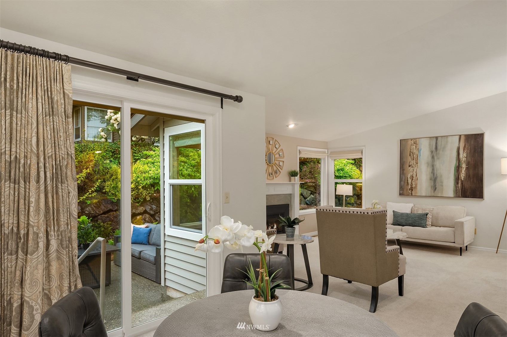 6730 114th Avenue Southeast Bellevue, WA 98006 - Photo 12 of 32 a living room with furniture and large windows