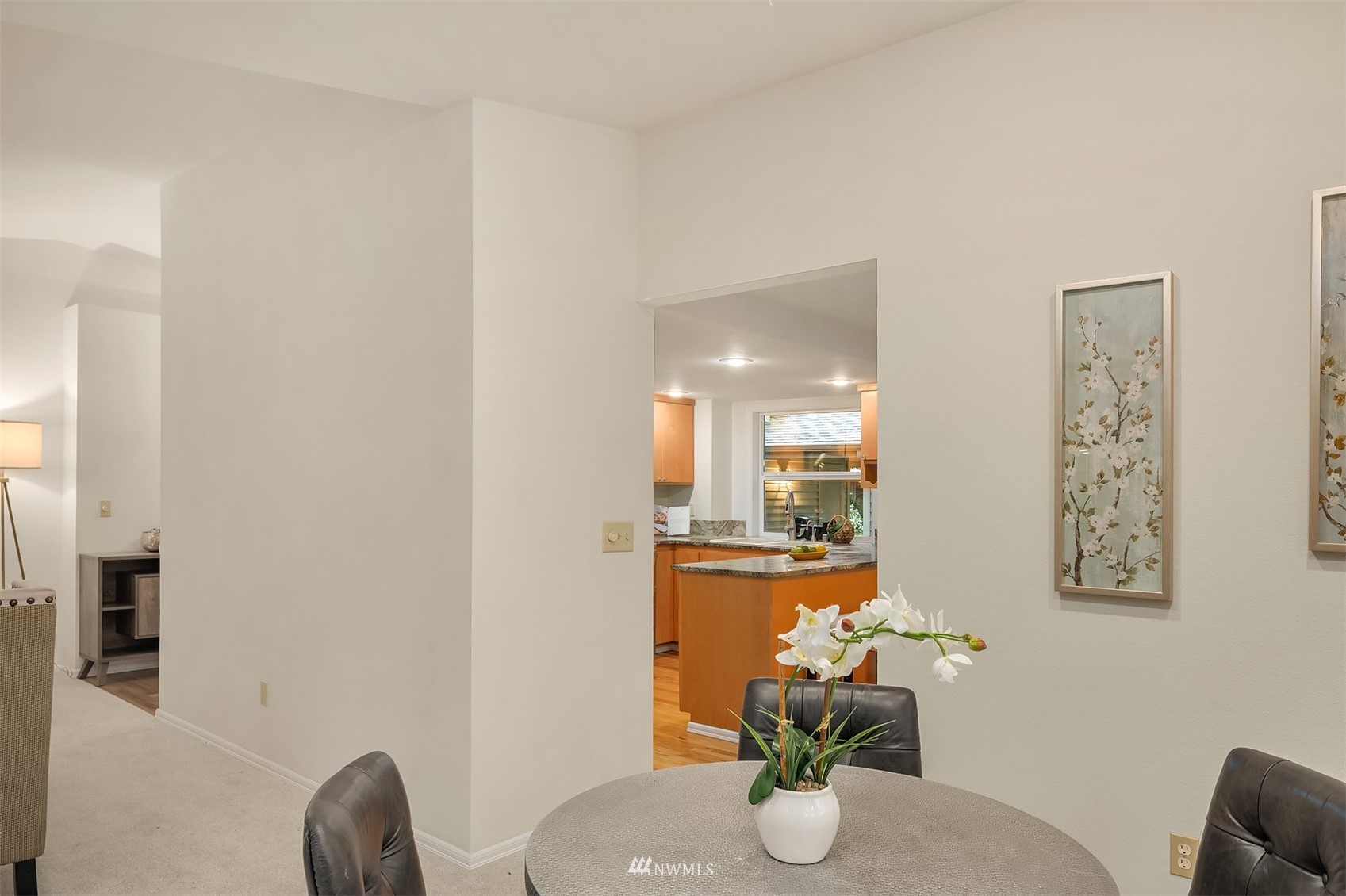6730 114th Avenue Southeast Bellevue, WA 98006 - Photo 13 of 32 a dining room with furniture and wooden floor