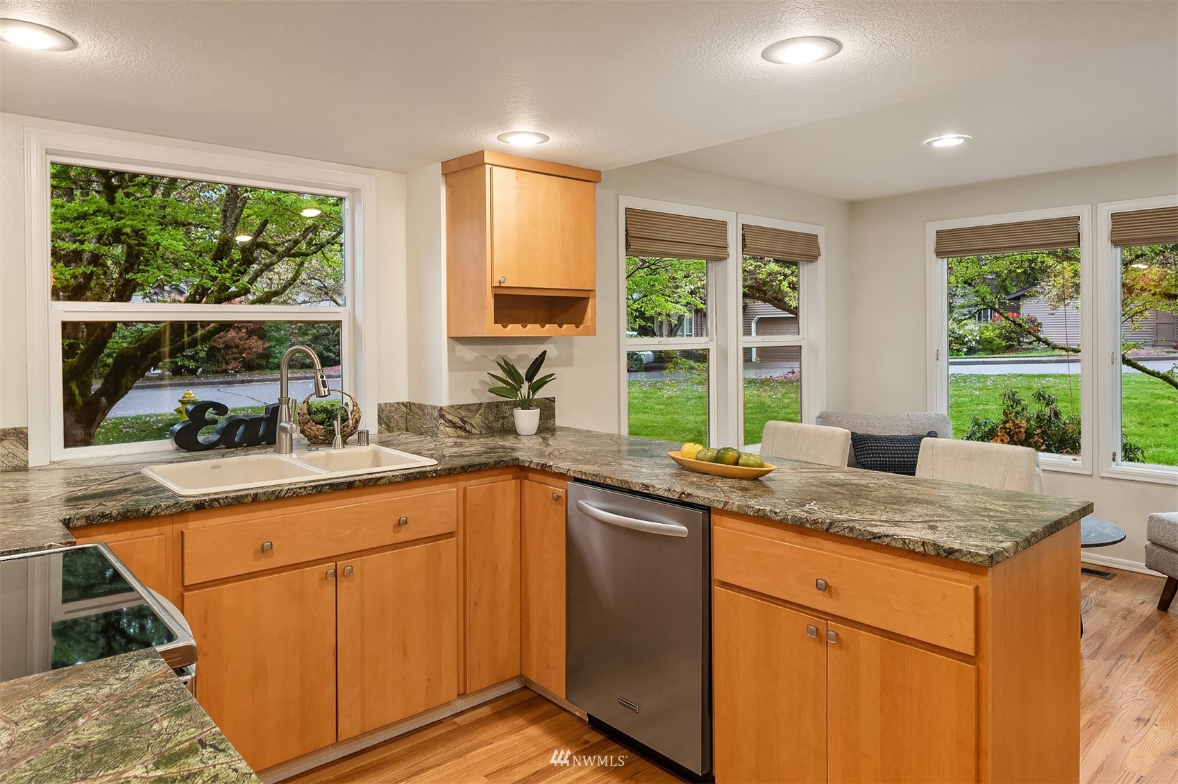 6730 114th Avenue Southeast Bellevue, WA 98006 - Photo 16 of 32 a kitchen with granite countertop sink and window