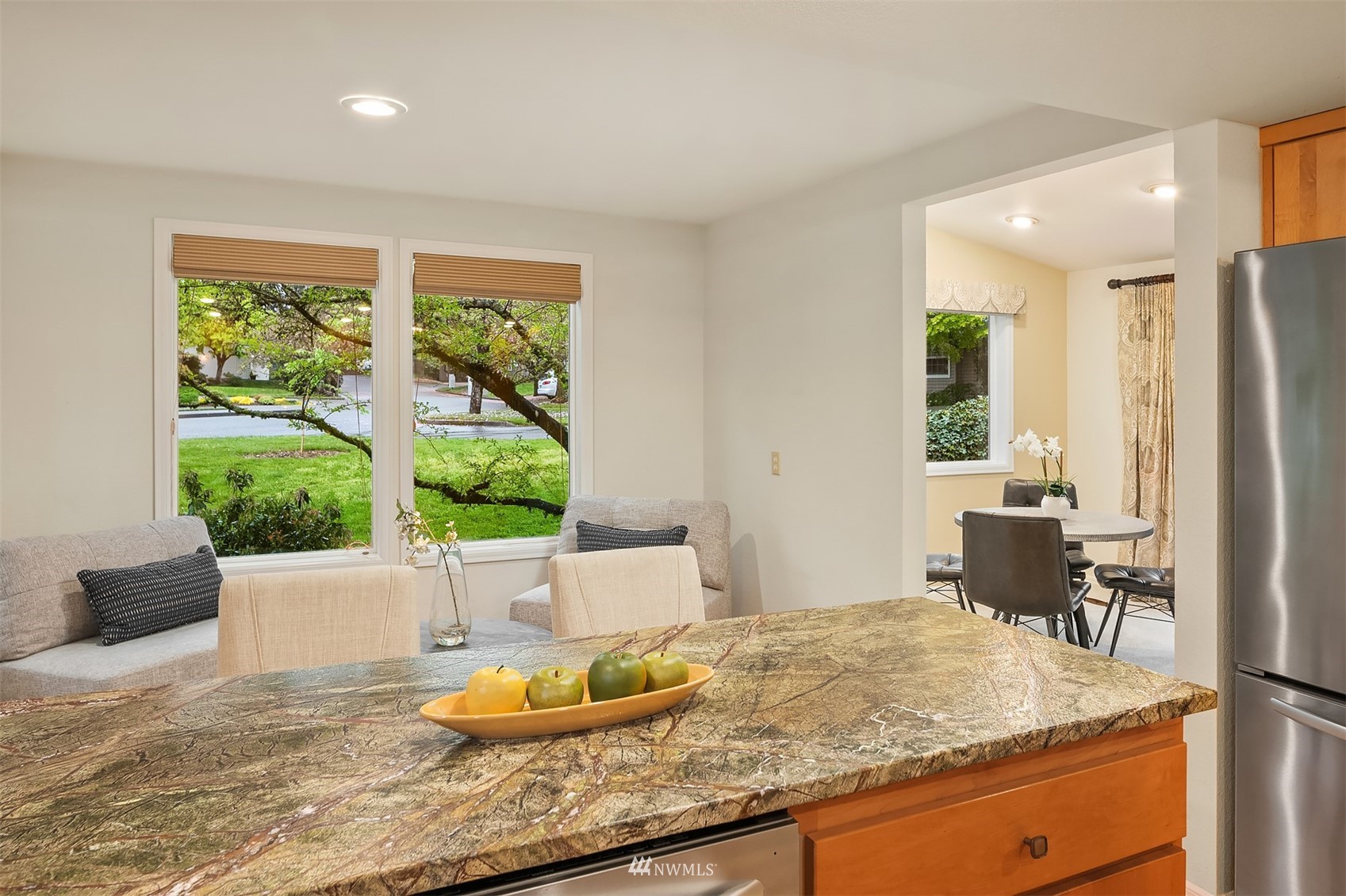6730 114th Avenue Southeast Bellevue, WA 98006 - Photo 18 of 32 a bathroom with a granite countertop sink and a large mirror