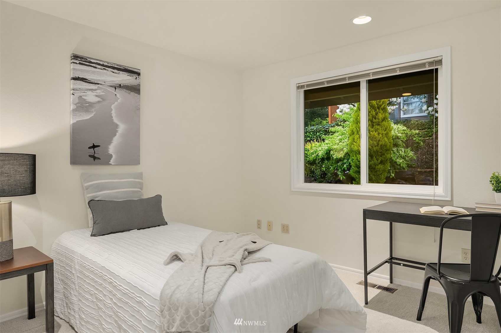 6730 114th Avenue Southeast Bellevue, WA 98006 - Photo 25 of 32 a bedroom with a bed and a window