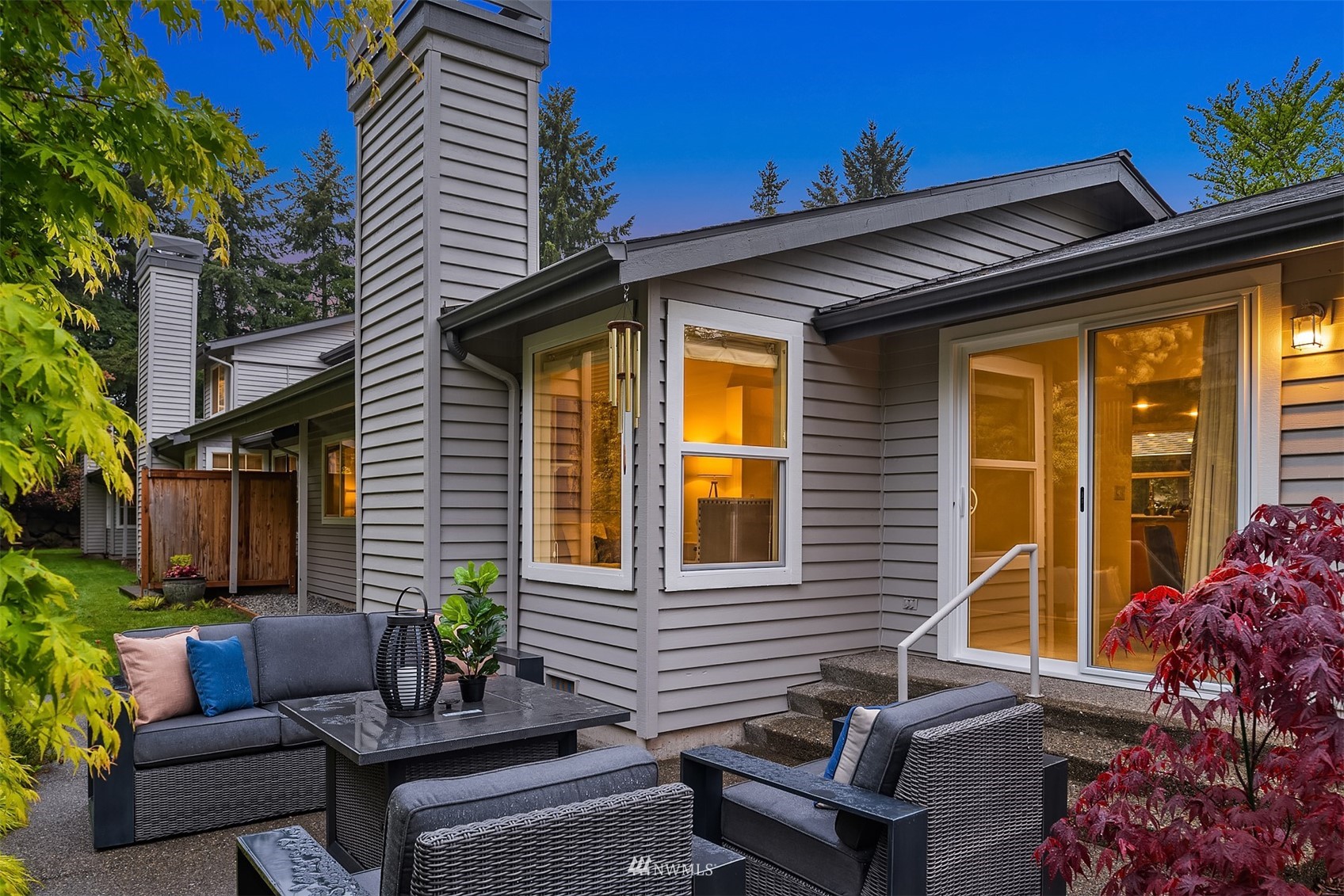6730 114th Avenue Southeast Bellevue, WA 98006 - Photo 29 of 32 a view of a patio with couches chairs and a potted plant