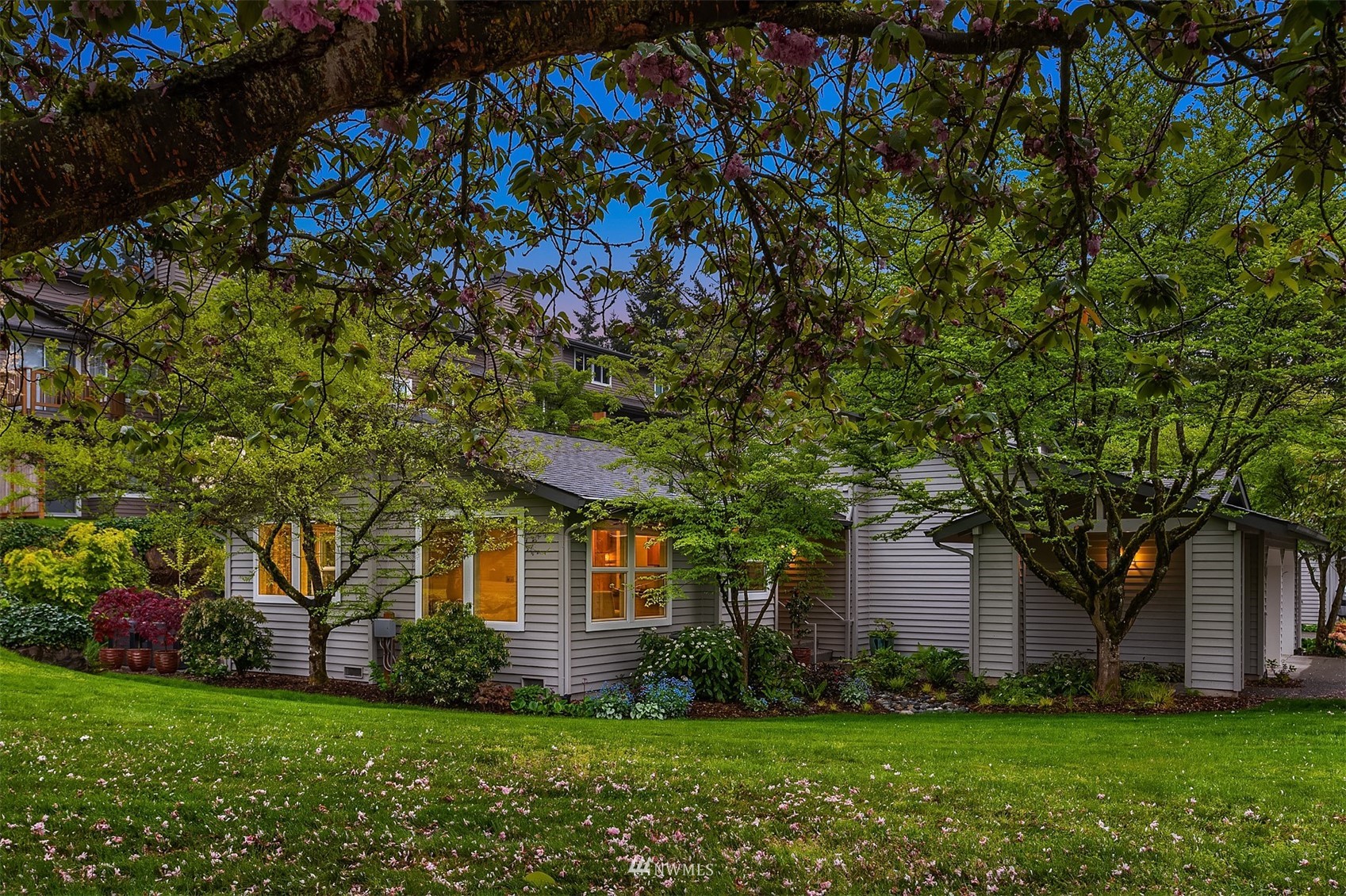 6730 114th Avenue Southeast Bellevue, WA 98006 - Photo 3 of 32 a front view of a house with a yard