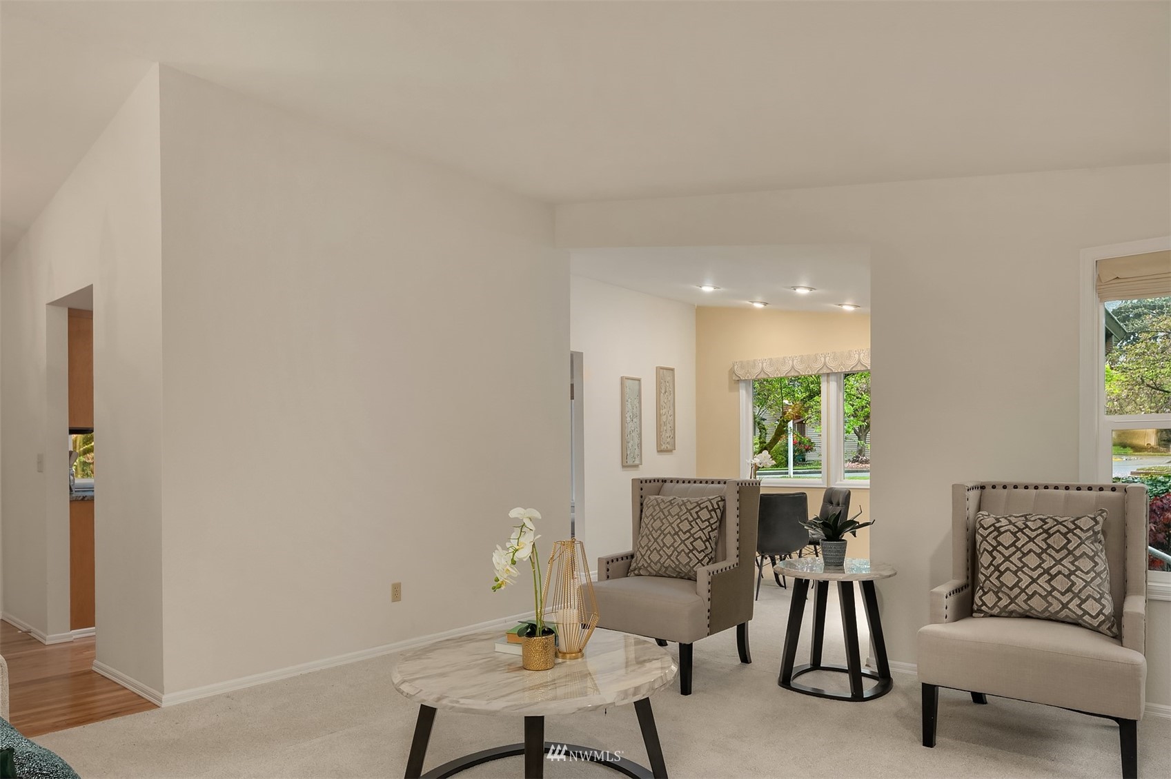 6730 114th Avenue Southeast Bellevue, WA 98006 - Photo 9 of 32 a living room with furniture and a potted plant