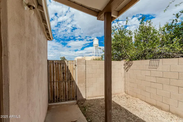 a front view of a house with plants