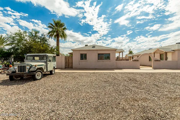 a view of a house with truck parked in front of a house