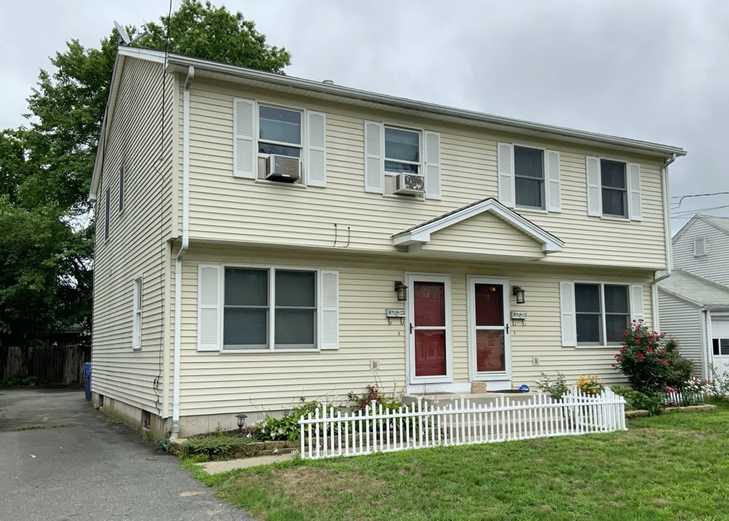 39-41 Eddy Street Springfield, MA 01104 - Photo 1 of 21 a view of a house with a yard and plants