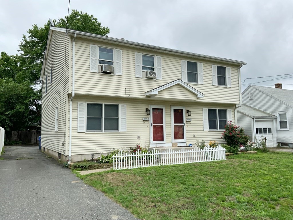 39-41 Eddy Street Springfield, MA 01104 - Photo 21 of 21 a front view of a house with a yard