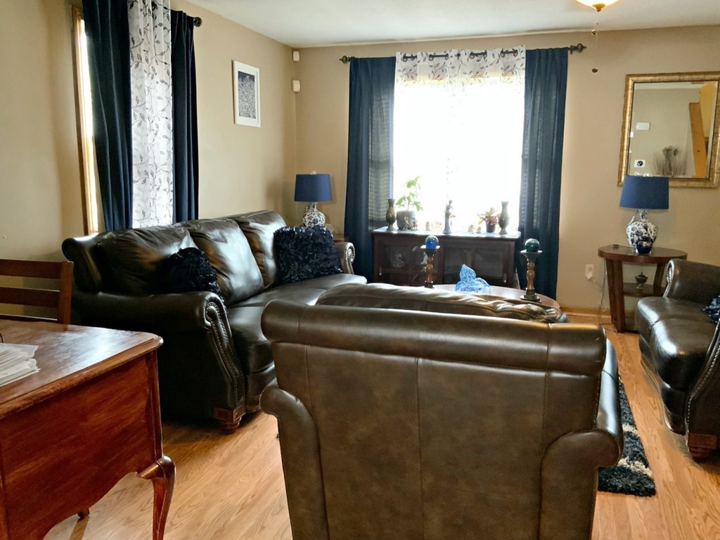 39-41 Eddy Street Springfield, MA 01104 - Photo 5 of 21 a living room with furniture and a window