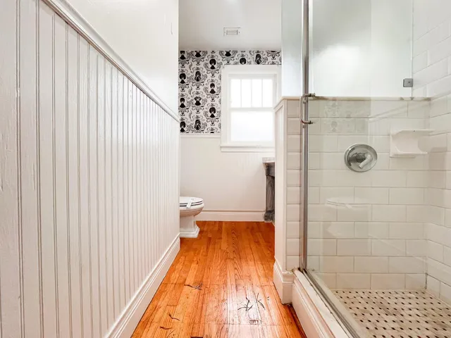 a bathroom with a bathtub and shower