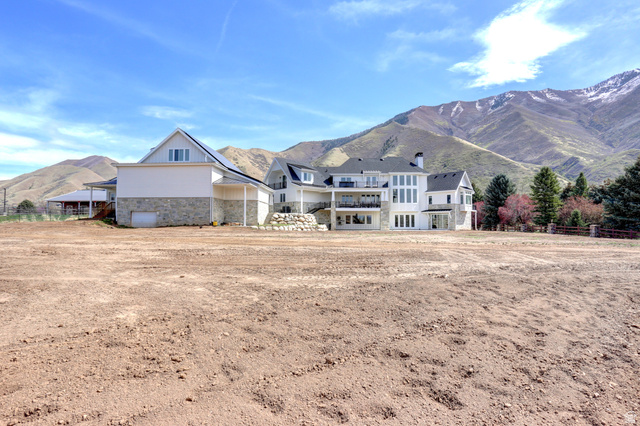 1354 South 800 East Mapleton, UT 84664 - Photo 125 of 129 Back of property featuring a mountain view, stone siding, and a balcony