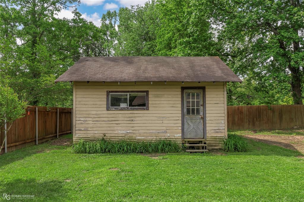 905 College Street Doyline, LA 71023 - Photo 23 of 26 a backyard of a house with lots of green space