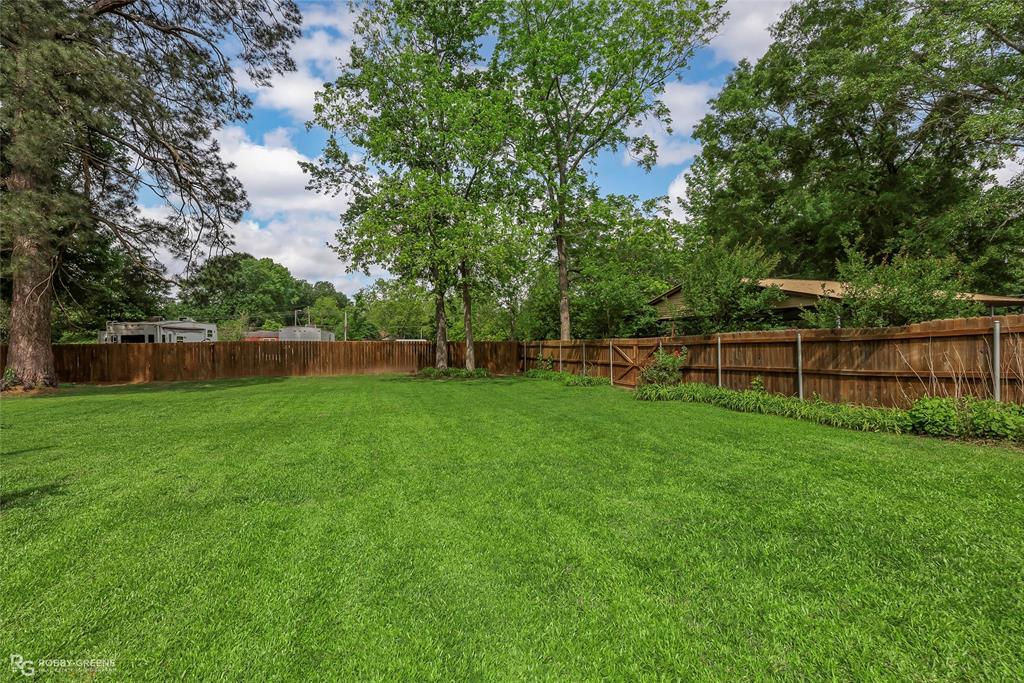 905 College Street Doyline, LA 71023 - Photo 24 of 26 a view of a yard with a tiny play house