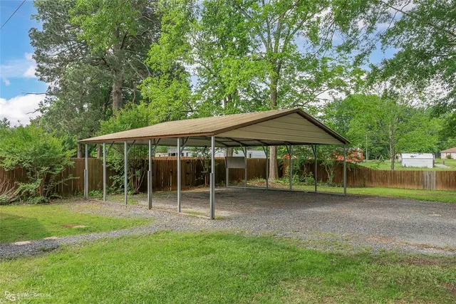 a view of a house with backyard and porch