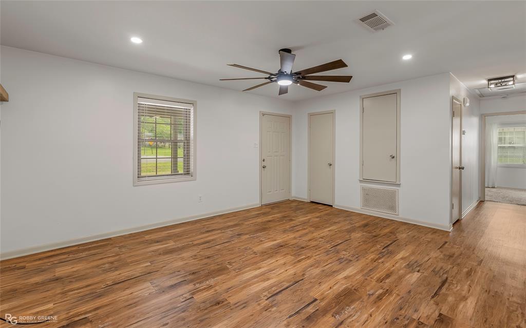 905 College Street Doyline, LA 71023 - Photo 4 of 26 a view of empty room with wooden floor and fan