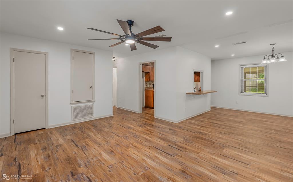905 College Street Doyline, LA 71023 - Photo 5 of 26 a view of empty room with wooden floor and window