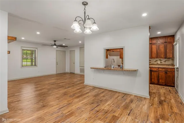 a view of a kitchen with a dishwasher stove and cabinets
