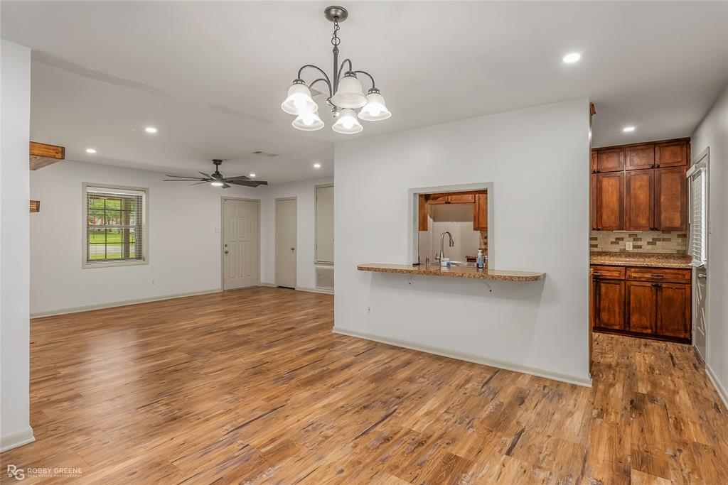 905 College Street Doyline, LA 71023 - Photo 8 of 26 a view of a kitchen with a dishwasher stove and cabinets