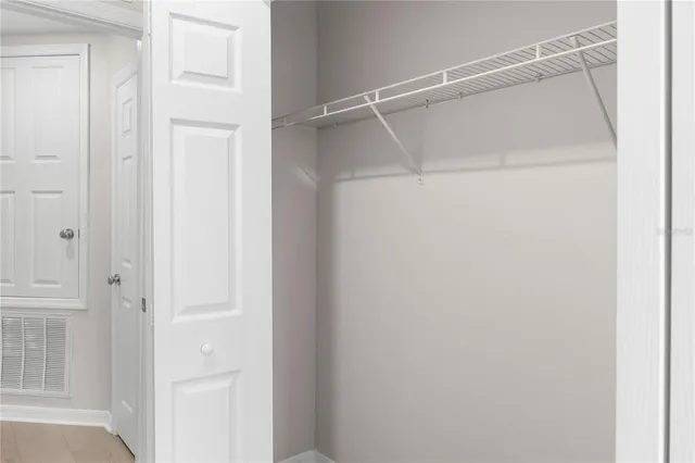 a view of an empty walk in closet