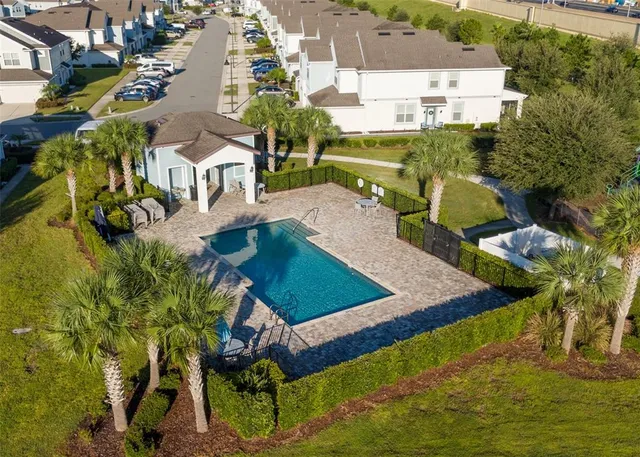 a view of a swimming pool with a patio