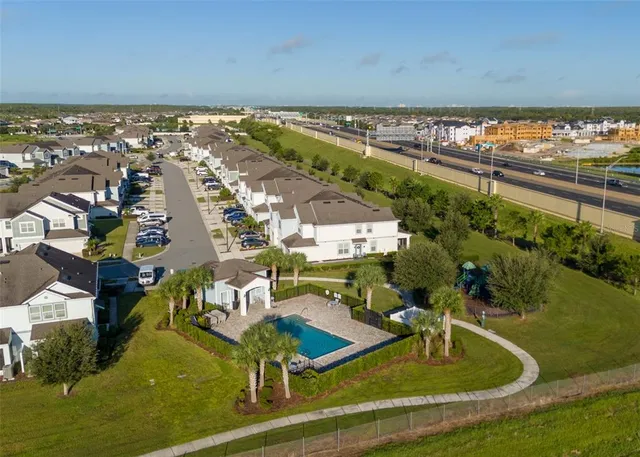 a view of a swimming pool with seating area