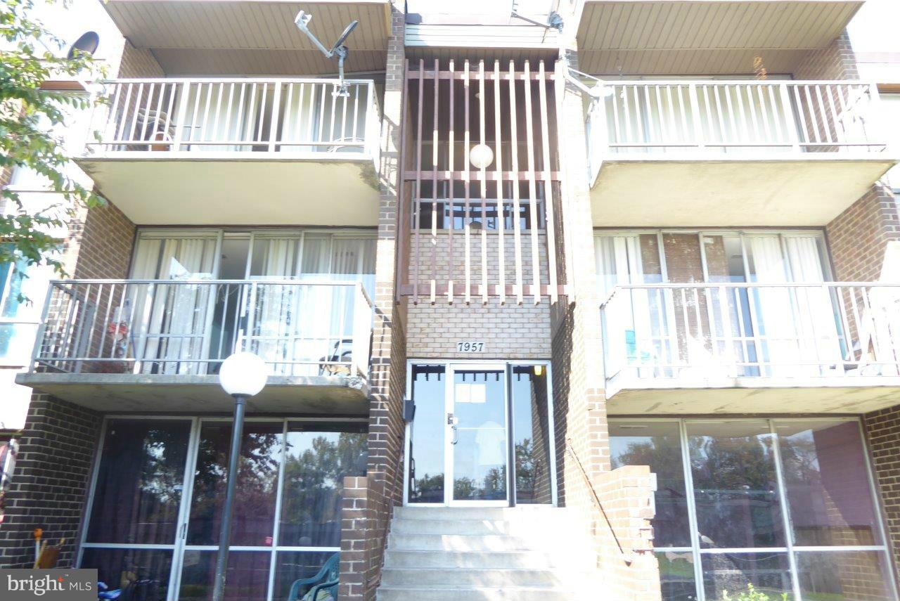7957 Riggs Road, Unit 2 Hyattsville, MD 20783 - Photo 1 of 17 a view of a house with a balcony