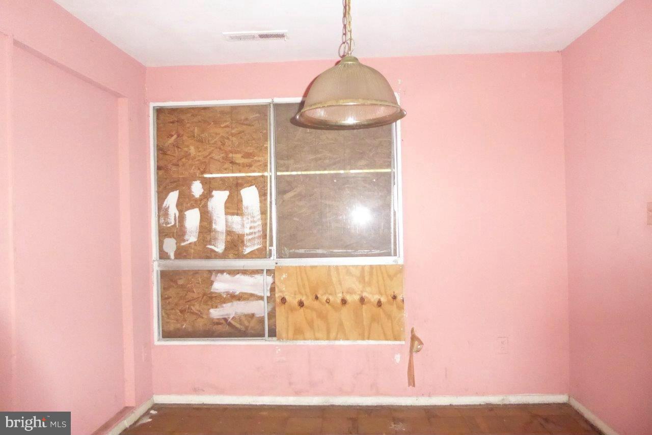 7957 Riggs Road, Unit 2 Hyattsville, MD 20783 - Photo 4 of 17 a view of a wooden door