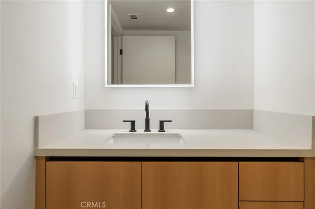 a bathroom with a bathtub and a sink