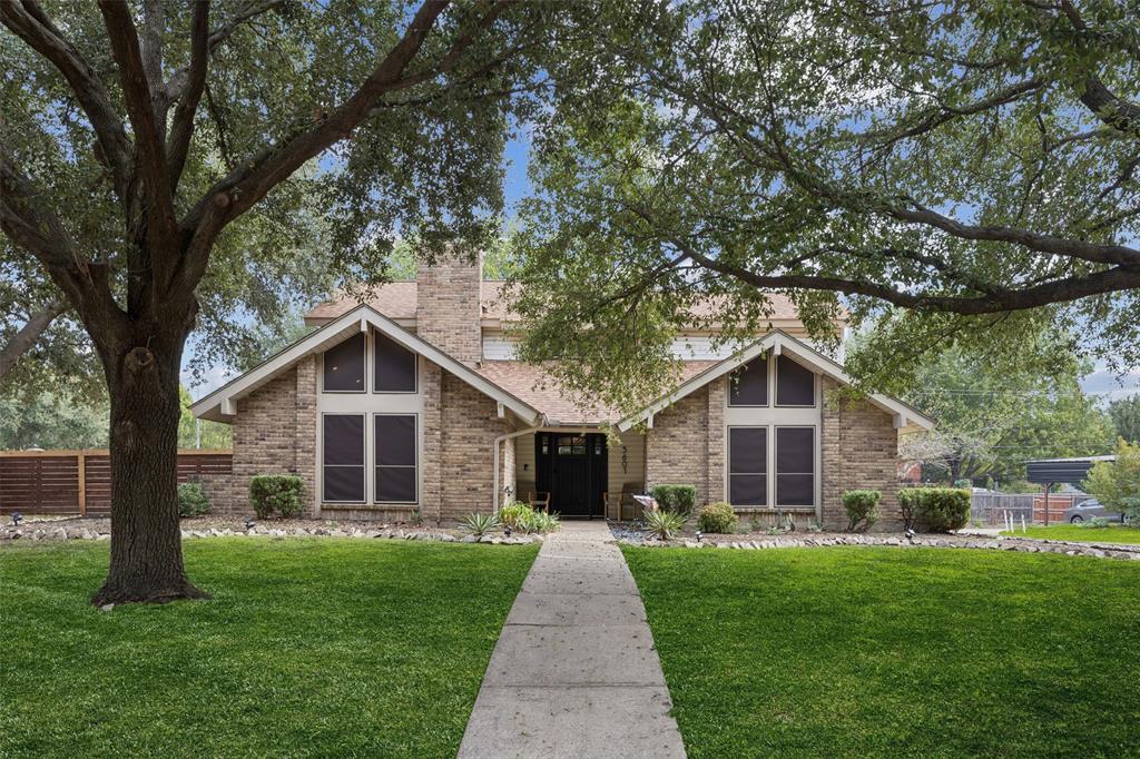 a front view of a house with yard