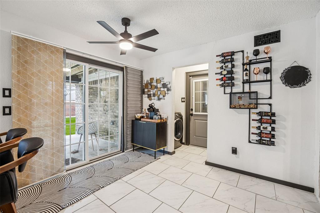 3601 Colosseum Way Grand Prairie, TX 75052 - Photo 15 of 28 a view of a livingroom with a ceiling fan and entryway