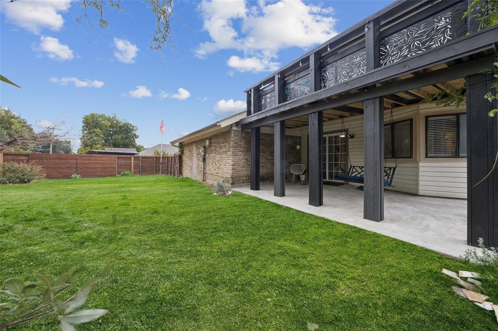 3601 Colosseum Way Grand Prairie, TX 75052 - Photo 27 of 28 a porch with a table and chairs