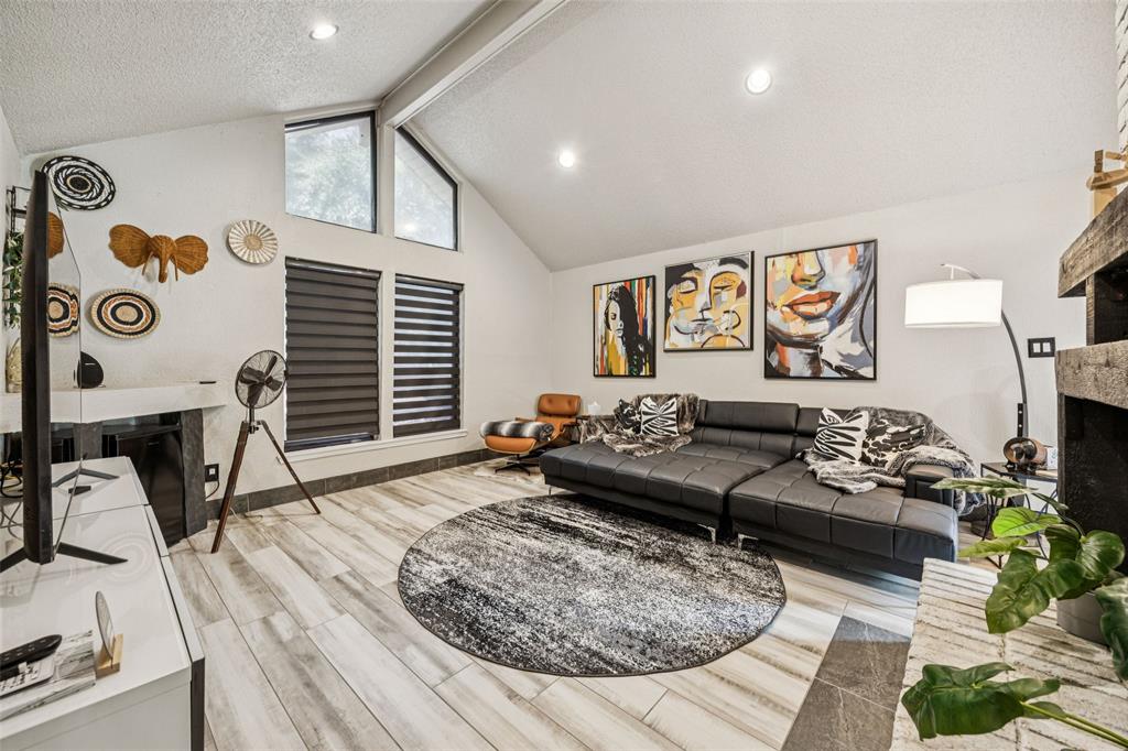 3601 Colosseum Way Grand Prairie, TX 75052 - Photo 3 of 28 a living room with furniture and a flat screen tv
