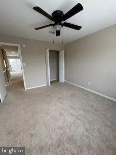 a view of a livingroom with a ceiling fan