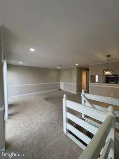 a view of a living room and kitchen