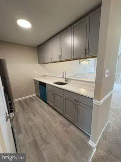 a kitchen with a sink and cabinets