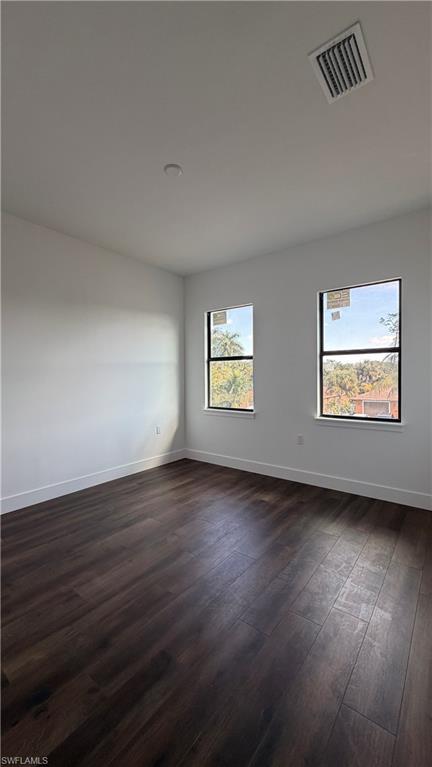 4710 Acadia Lane Naples, FL 34112 - Photo 10 of 10 an empty room with wooden floor and windows