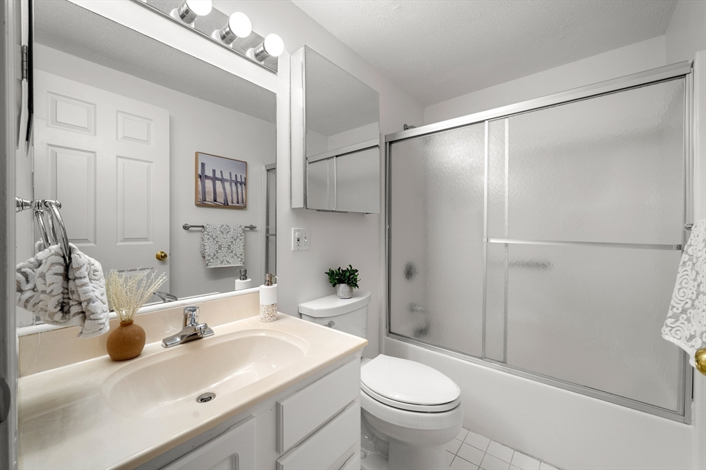 11 Church Street, Unit 203 Salem, MA 01970 - Photo 10 of 40 a bathroom with a sink toilet and shower