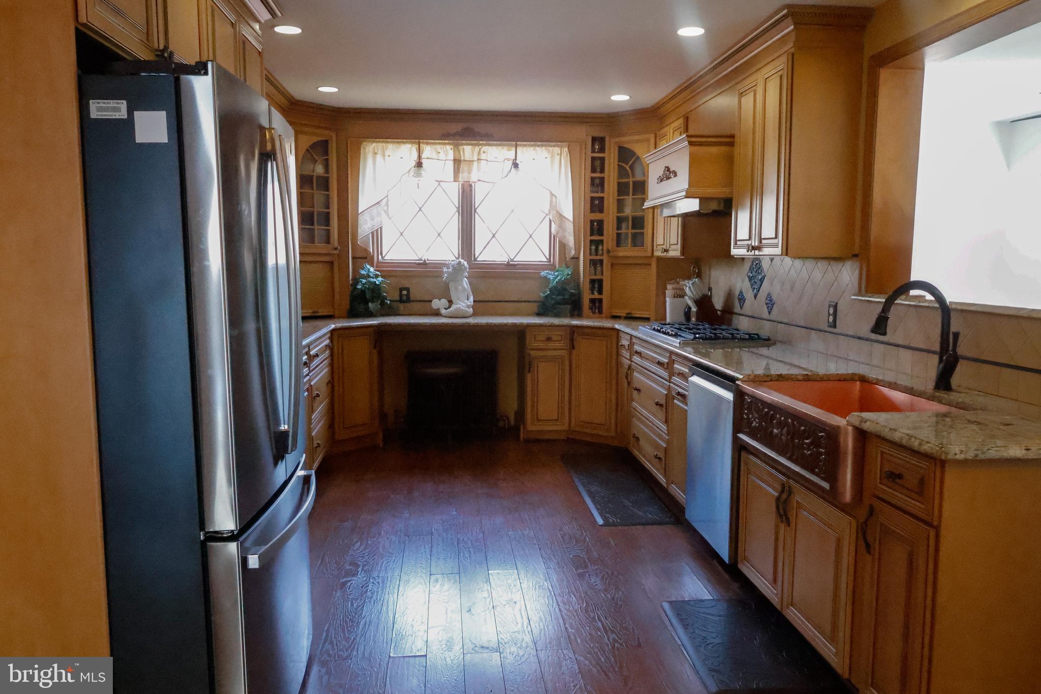 53 Kirkwood Road Gibbsboro, NJ 08026 - Photo 14 of 37 a kitchen with stainless steel appliances granite countertop a stove a sink and a refrigerator